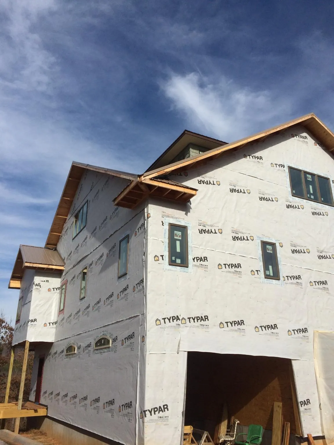 Stick built house wrapped in Typar with new roof framing and dormers in Gardiner
